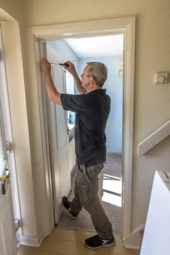 Removing doors before underfloor heating installation