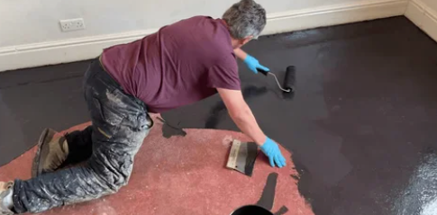 Applying damp proof membrane before underfloor heating installation