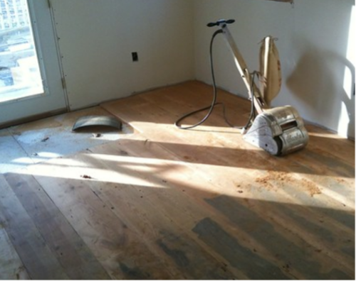 Levelling timber floorboards for overlay underfloor heating
