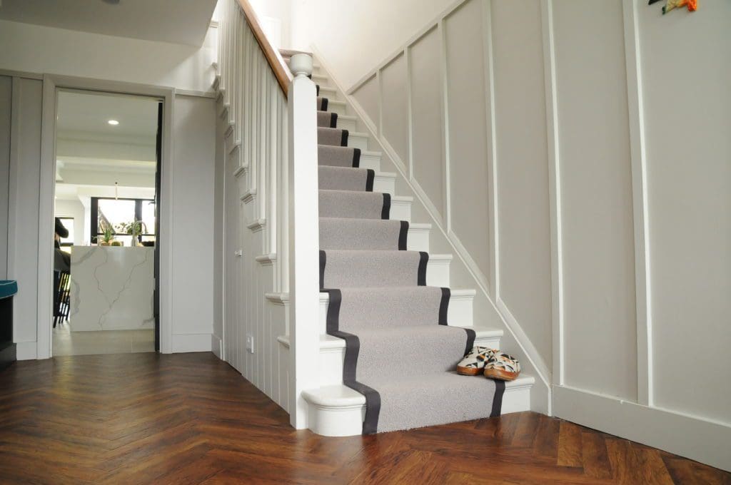 Hallway with wooden flooring under which our heating system is installed