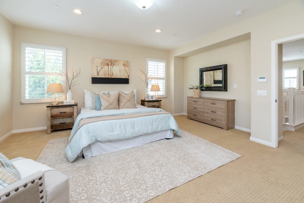 Beautiful neutral coloured bedroom with a Wunda Smart Heating system installed