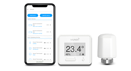 A phone displaying the WundaSmart app beside a WundaSmart Thermostat and a radiator head