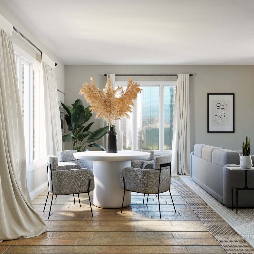 a stylish and neutral living room with hardwood floors and light shining through the windows