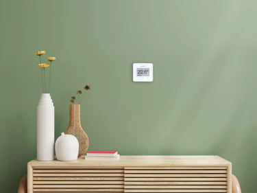 Wundasmart thermostat on a green wall