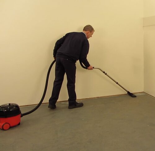 Vacuuming subfloor before installing Rapid Response boards